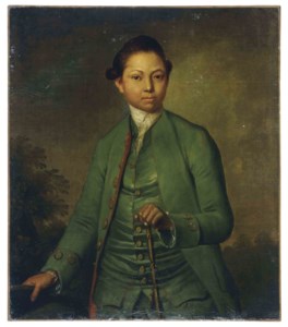 Portrait of a young man wearing a green jacket holding a cane
