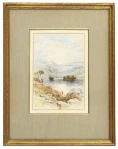 Sheep in a mountainous landscape by a lake