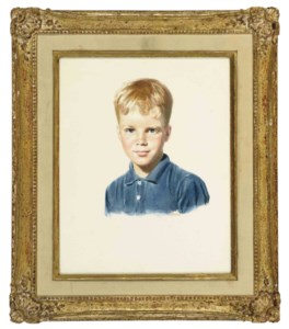 Portrait of a young boy wearing a blue collared shirt