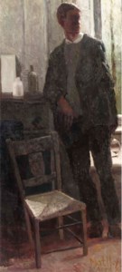 Standing man near a fire place