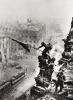 A group of 5 variant photographs depicting Soviet soldiers raising the Communist Red Flag over the Reichsta