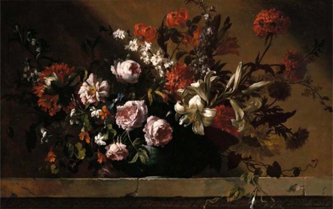 Roses, tulips, lilies and other flowers in a ceramic dish on a stone ledge