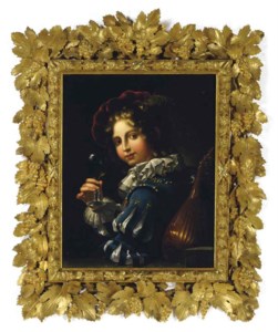 A youth holding a glass of wine and a mandoline