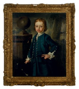 Portrait of a young boy wearing a blue coat, standing in a landscape