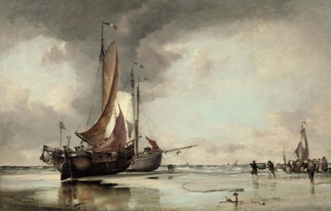 Dutch pincks beached on the shore at Scheveningen with fishermen unloading the day's catch