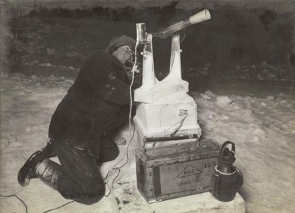 C.S. Wright working at night with the transit, August 8, 1911