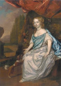 Portrait of a lady, full-length, in a white satin dress and blue wrap, seated in a garden with a spaniel nearby