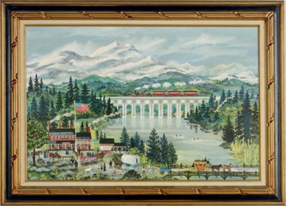 A red train passing over a busy town