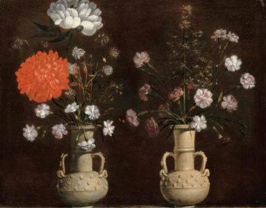 Two grey terracotta vases with flowers