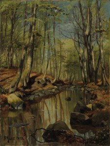 A wooded river landscape
