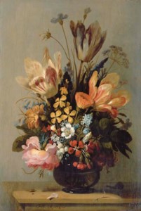 Tulips, a rose, bluebells and other flowers in a glass vase on a wooden ledge, with a snail and a caterpillar