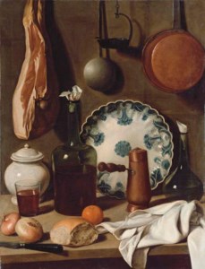 A glass bottle, a blue and white porcelain platter, a copper coffee pot, a flask, a covered jar, a tumbler of wine, a knife, bread, onions and an orange on a partially-draped table, with a ham and pans suspended from the wall