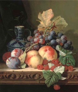 Plums, peaches, raspberries, grapes and a stoneware jug on a carved table