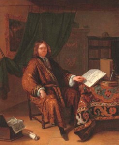 Portrait of a connoisseur, full-length, seated at a draped table with books, prints and writing implements in a library interior