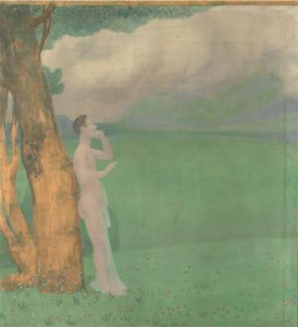 Homme debout sous un arbre
