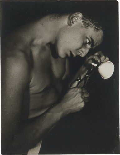 Lincoln Kirstein Attempting to Cut the Stem of a Funnel