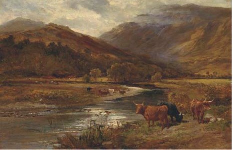 Highland cattle grazing by a river