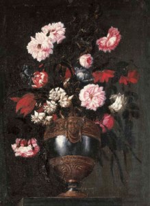 Peonies, roses, tulips and other flowers in a pewter vase with a grotesque mask and other ormoulu decorations