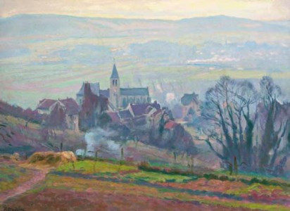 A meadow before a French village