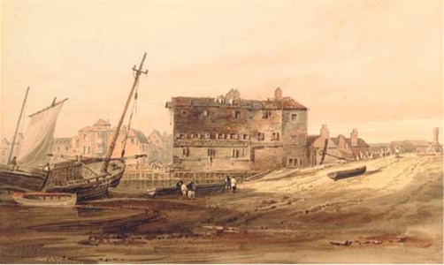 Shipping Vessels beached by an old wharf with a town beyond