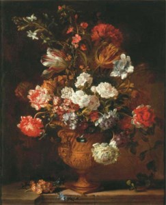 Parrot tulips, chrysanthemums, primroses, morning glory and other flowers in a sculpted urn on a stone ledge