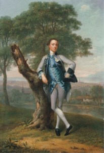 Portrait of Thomas Bateman Lane (b. 1735), small full-length, in a grey suit with a blue waistcoat, holding a tricorn in his left hand, leaning on a tree stump, in a river landscape with the sea beyond