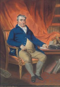 Portrait of the Right Honorable Charles James Fox, M.P. (1749-1806), seated in his study, in a blue coat and mustard waistcoat and britches