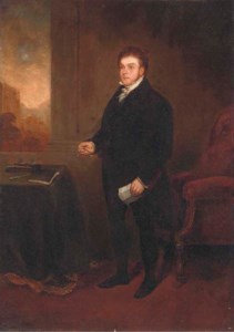 Portrait of Robert Hawkes (1774-1836), small full-length, holding a letter and spectacles, in an interior, a landscape beyond