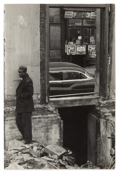 Man Standing Outside of a Building