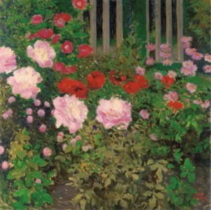 Blüende Blumen am Gartenzaun