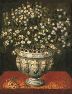 Myrtle in a lobed-footed polychrome maiolica Manises vase on a draped ledge