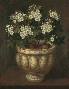 White roses in a lobed-footed copper-lustre maiolica Manises vase on a ledge