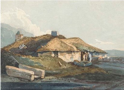 Figures before a thatched cottage, Devon