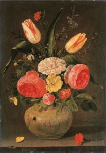 Roses, tulips, carnations and other flowers in a stoneware vase with ornamental relieves on a stone ledge