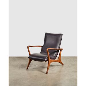 'Contour' Lounge Chaircirca 1955for Kagan-Dreyfuss, American black walnut, leatherheight 33 1/4in (84.5cm); width 28 1/2in (78.5cm); depth 34in (86.cm)