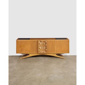 Custom Order Credenzacirca 1940for Kagan Dreyfuss, relief-carved walnut, granite, fitted illuminated LED interior, stamped 'KAGAN. DREYFUSS. NEW YORK VLADIMIR KAGAN DESIGN', LED interior lighting fitted by Lobel Modernheight 33in (83.8cm); width 90in (229cm); depth 22in (56cm)