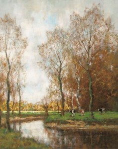 Cows grazing by a stream in a wooded landscape