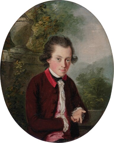 Portrait of a young man in a garden landscape