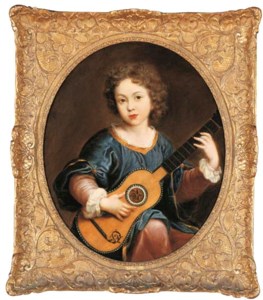 A young girl playing a guitar