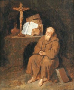 A hermit seated by an altar in a grotto