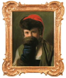 A young girl hiding behind a muff