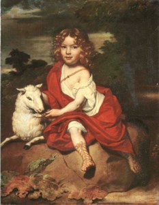 Portrait of a young boy, seated full-length, with a sheep, on a rock, a wooded landscape beyond
