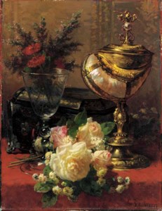 A Bouquet of Roses and other Flowers in a glass Goblet with a Chinese Lacquer Box and a Nautilus Cup on a red Velvet draped Table
