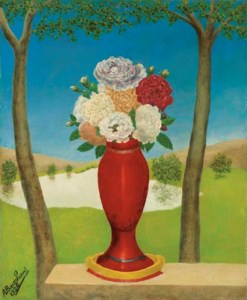 Vase de roses sur un muret