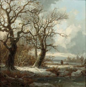 A winterlandscape with a traveller on a path