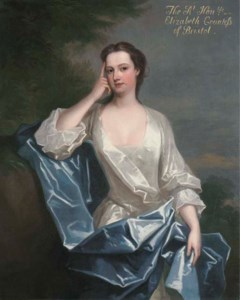 PORTRAIT OF A LADY, TRADITIONALLY IDENTIFIED AS ELIZABETH FELTON, OF PLAYFORD, LATER COUNTESS OF BRISTOL (1677-1741), THREE-QUARTER-LENGTH, SEATED IN A WHITE DRESS WITH A BLUE WRAP, IN A WOODED LANDSCAPE