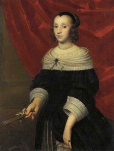 Portrait of a lady, three-quarter-length, in a black dress with a white lace collar and cuffs, a fan in her right hand, before a red curtain