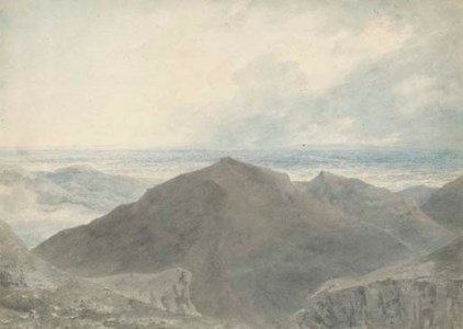 A figure in an extensive mountainous landscape