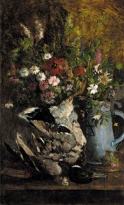Summer flowers in a jug alongside a mallard on a table