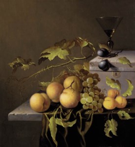 Peaches and grapes on the vine, with a goblet of wine on a casket, on a partially draped stone ledge